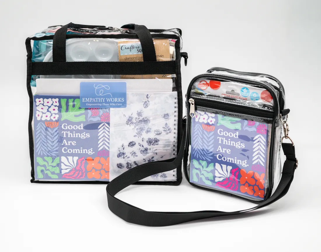 Studio product photography of Empathy Works craft kit bags on a white background